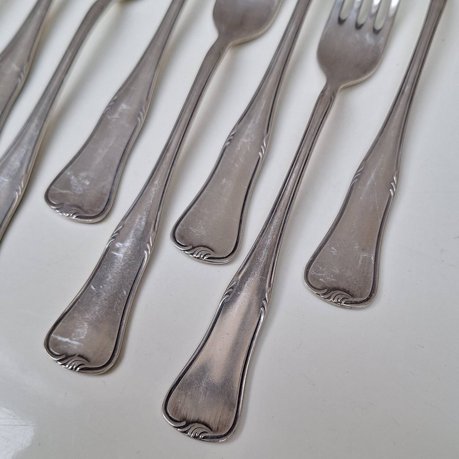Set of small silver-plated metal forks