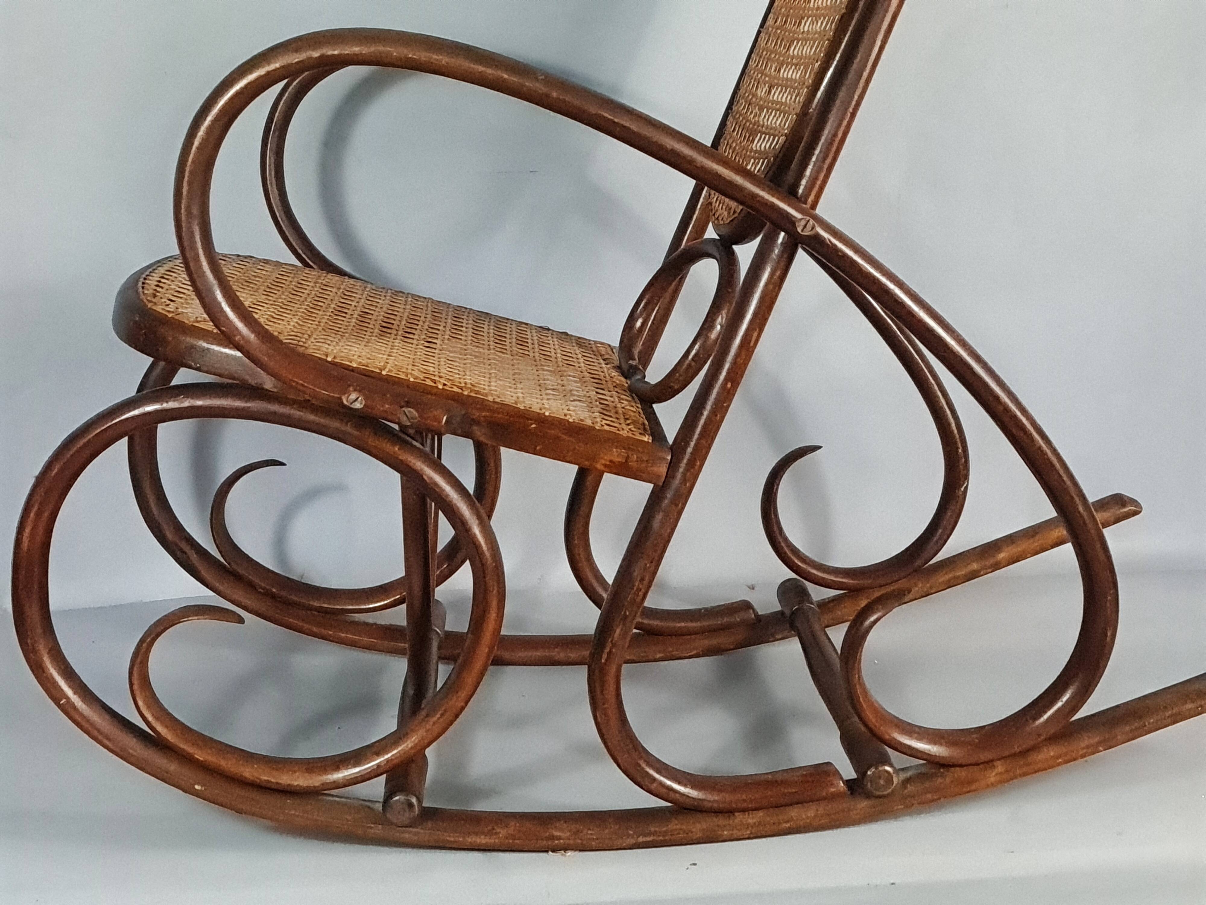 Vintage curved wood rocking chair for children with recent caning model D912.
