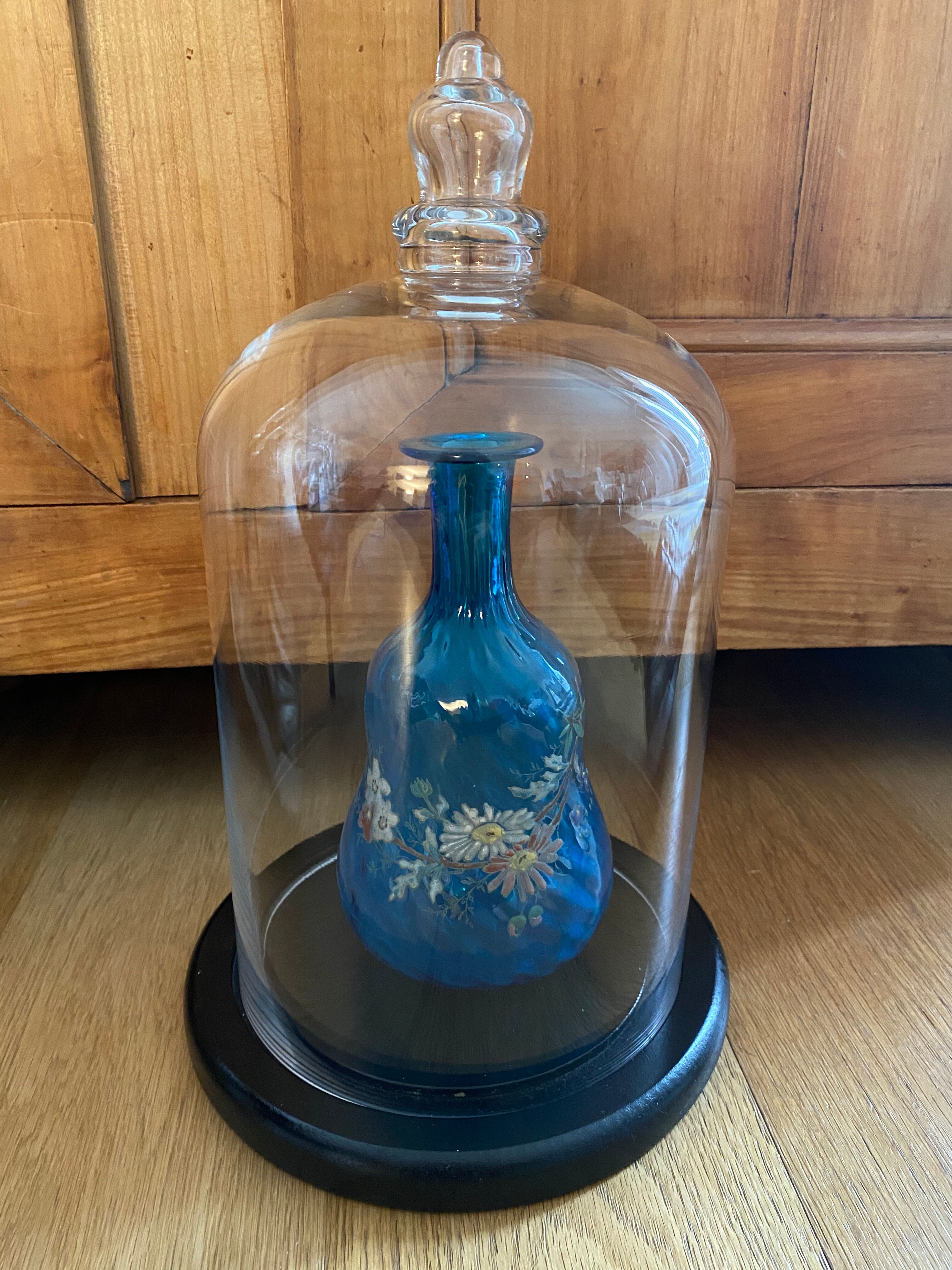 Large old glass bell and its wooden base