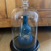 Large old glass bell and its wooden base