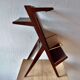 Old Scandinavian style magazine rack in dark wood with integrated brass ashtray