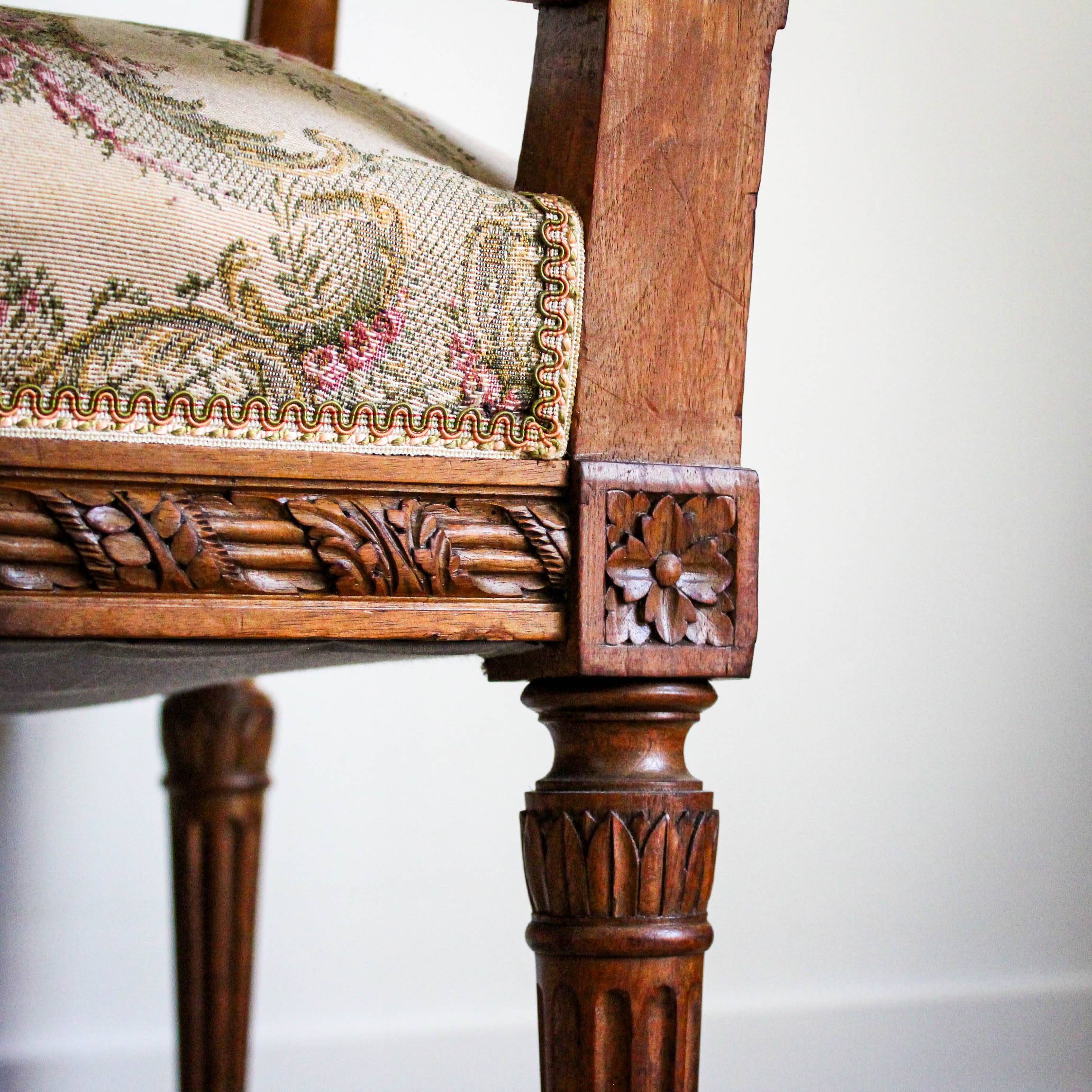 Louis XVI style carved armchair