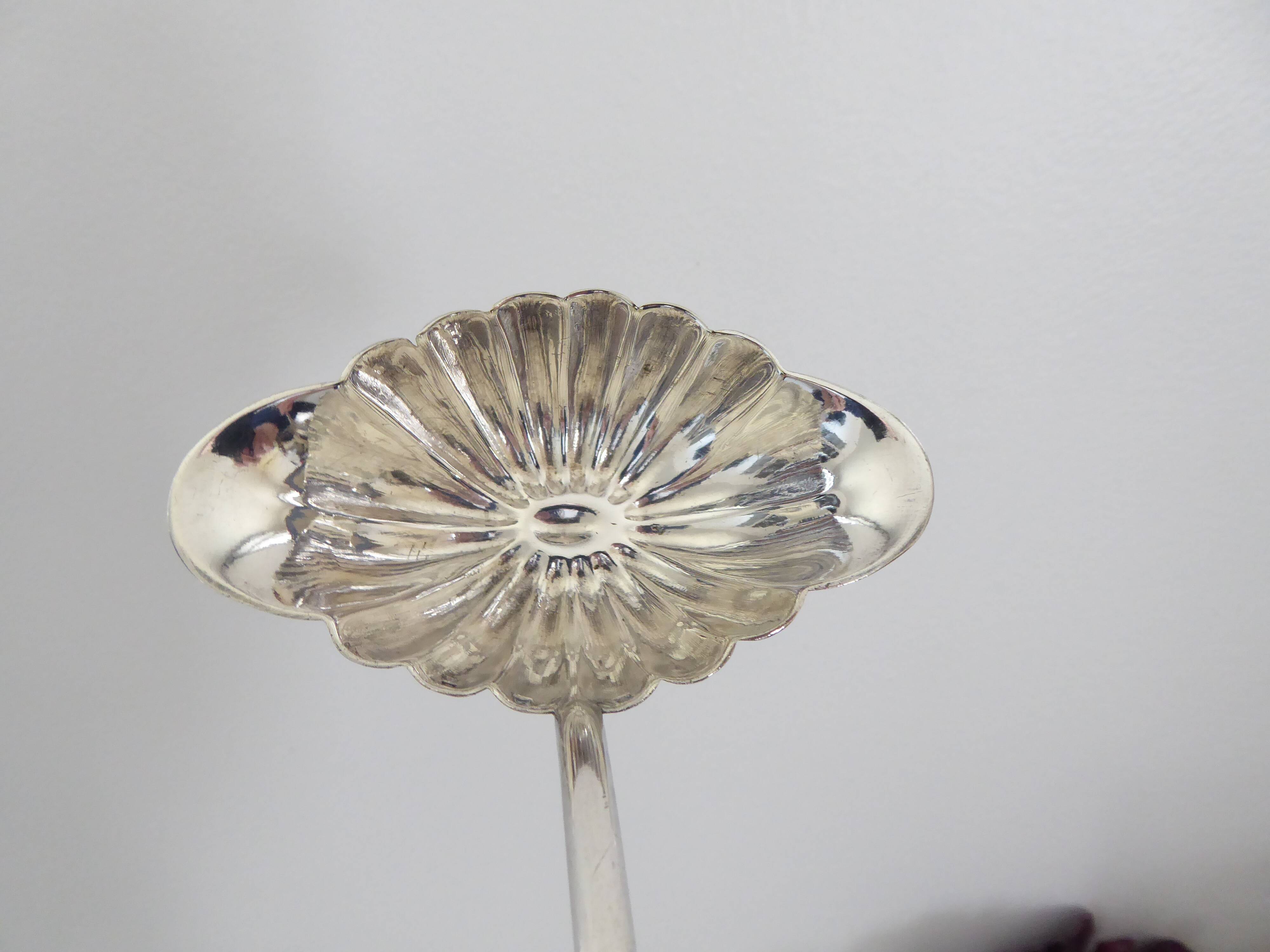 Silver metal sauce ladle
