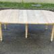 Renovated Louis Philippe round extendable dining table with 4 leaves.