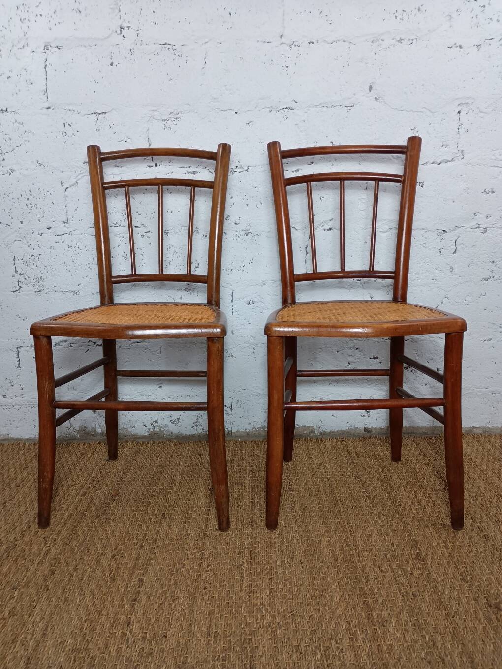 pair of caned bistro chairs from the 1930s