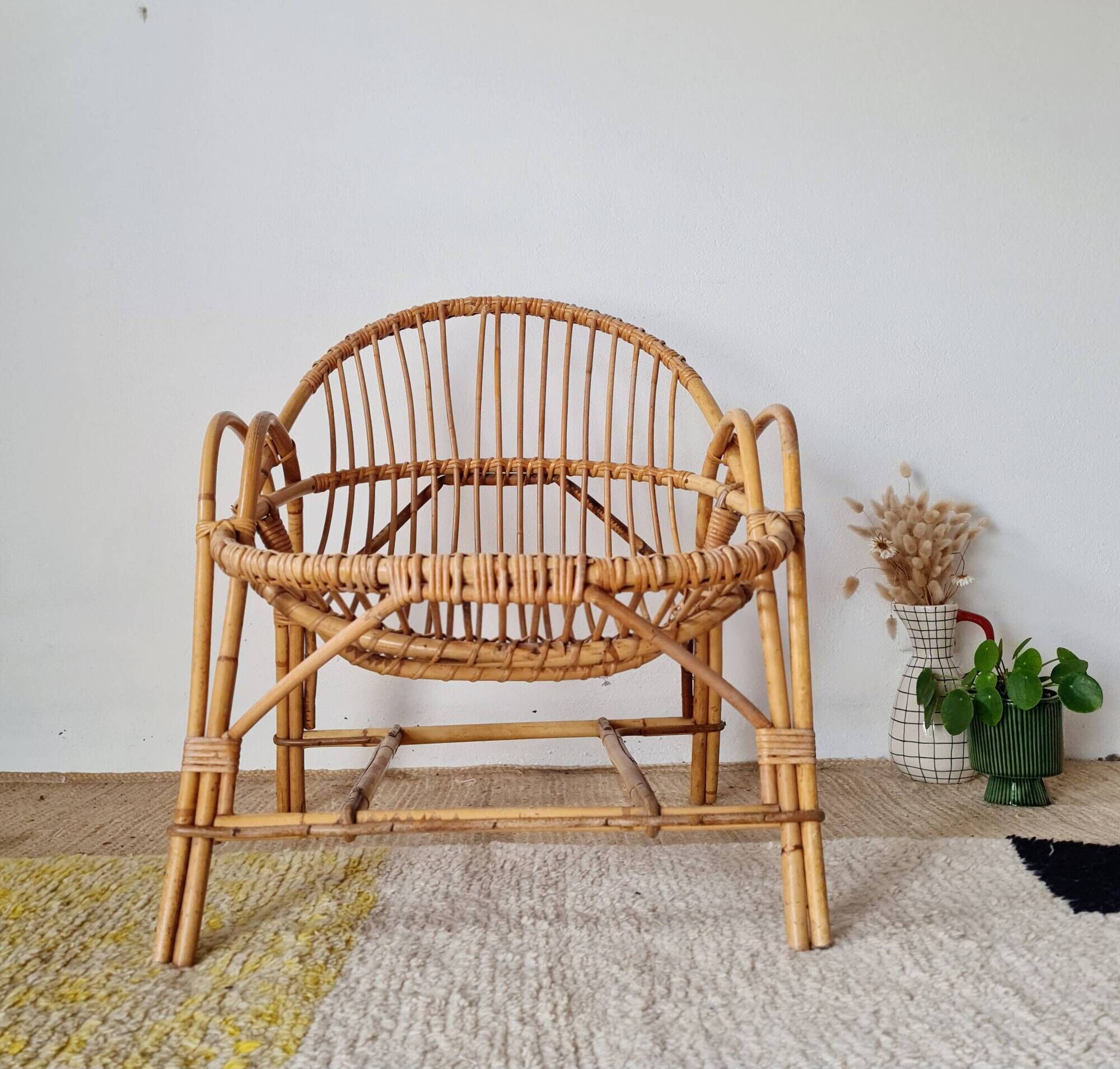 Vintage adult rattan armchair from the 1960s.