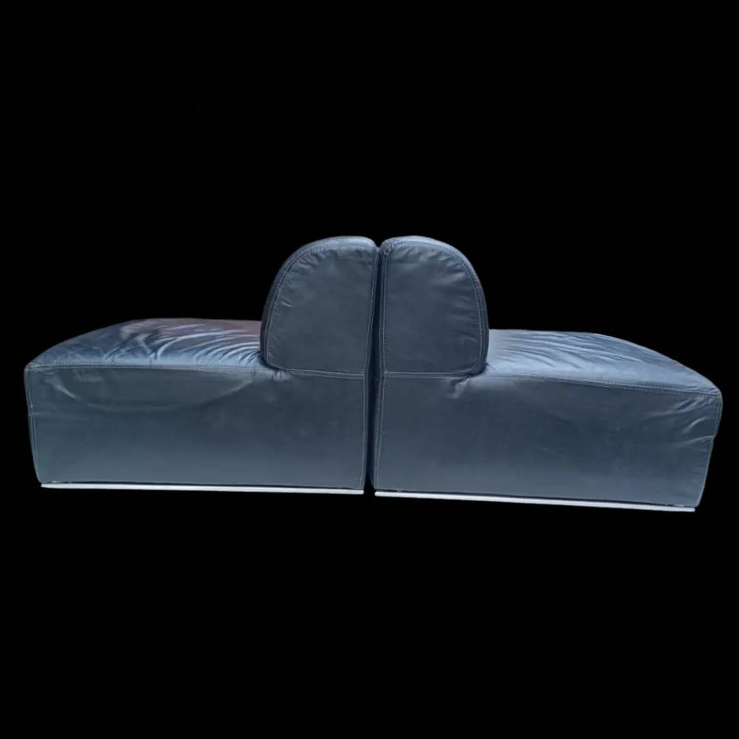 Pair of vintage black leather easy chairs