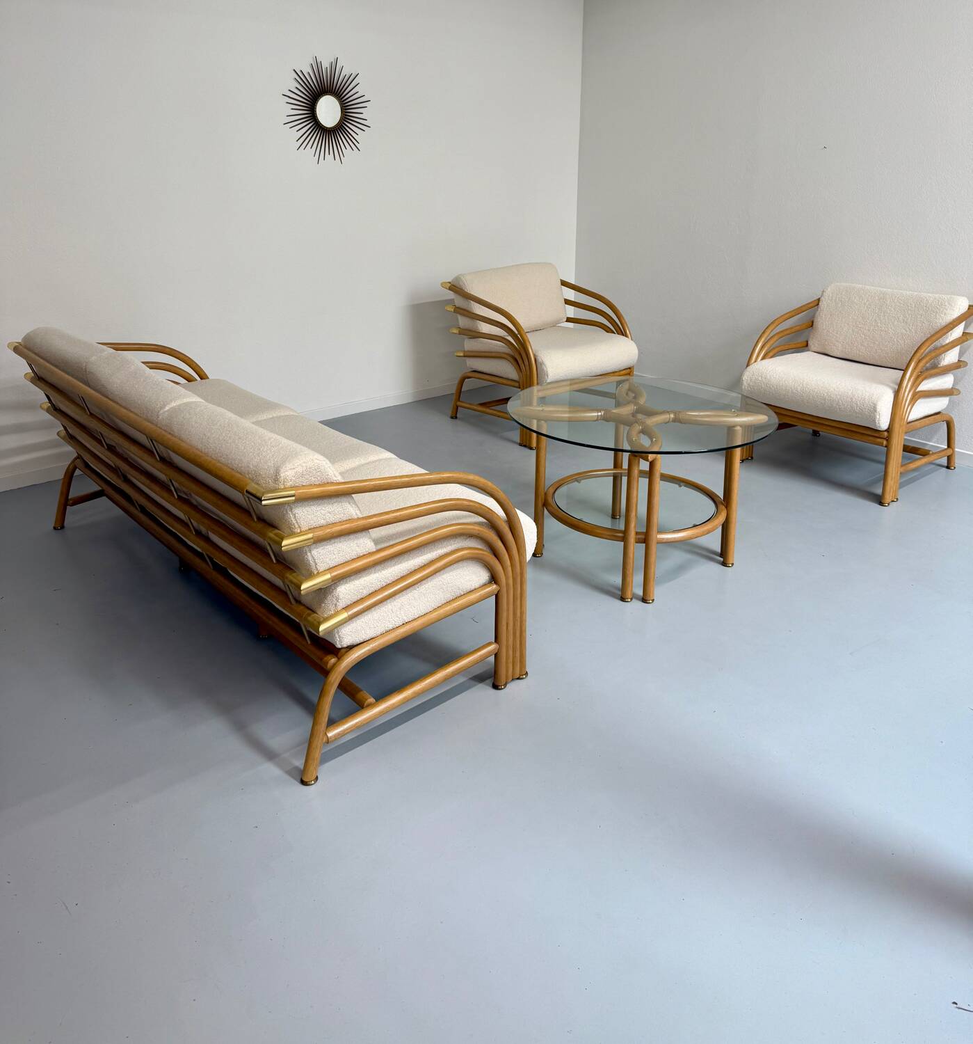 Complete living room with rattan sofa and white bouclette, brass finish, 80's design