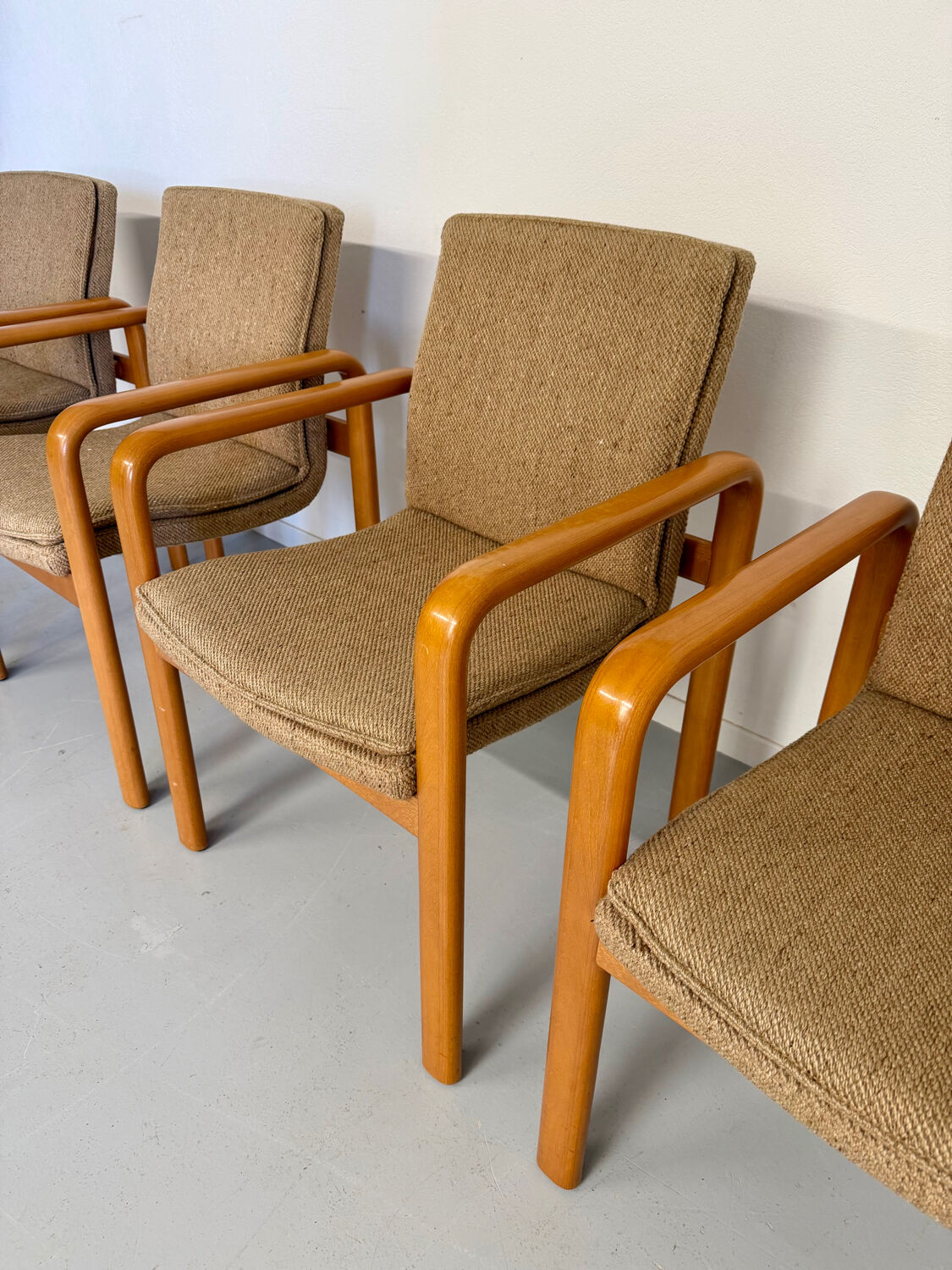 4 armchairs with armrests in beech and fabric, 1970s vintage design.