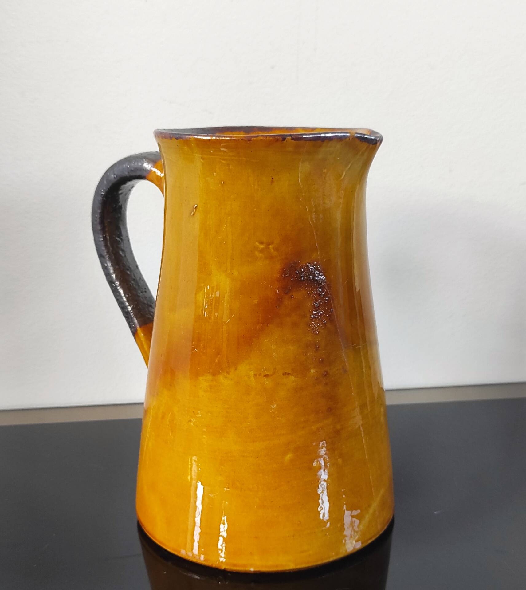 Vintage glazed terracotta pitcher