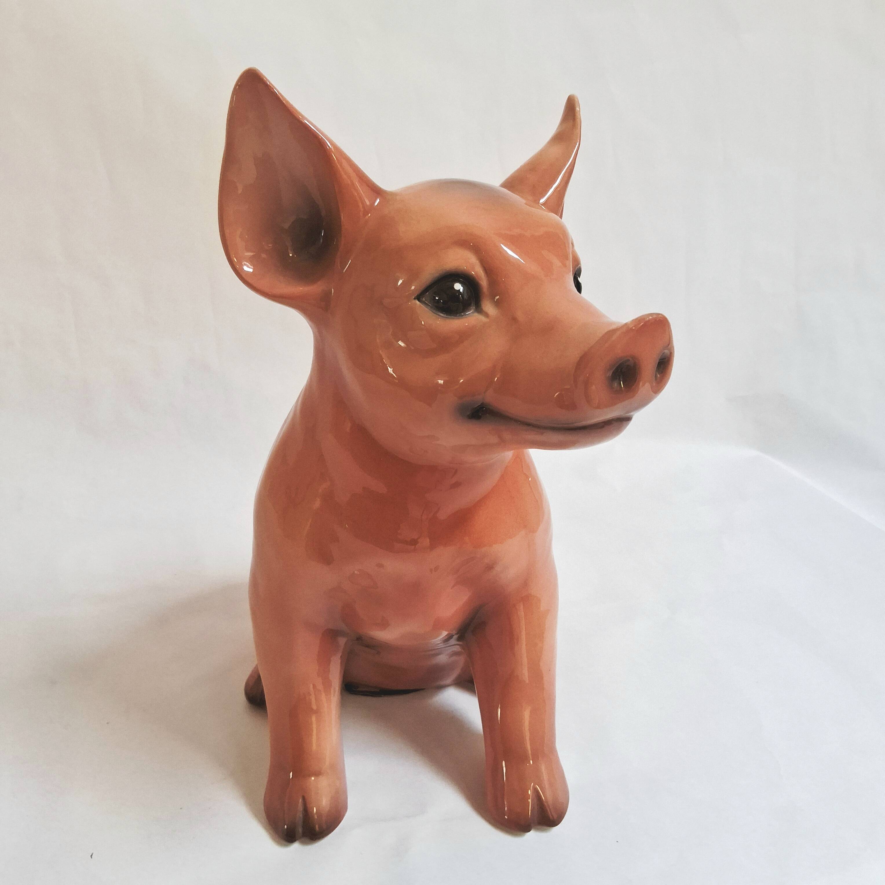 Beautiful, handcrafted porcelain figurine of a piglet, made by Capodimon.
