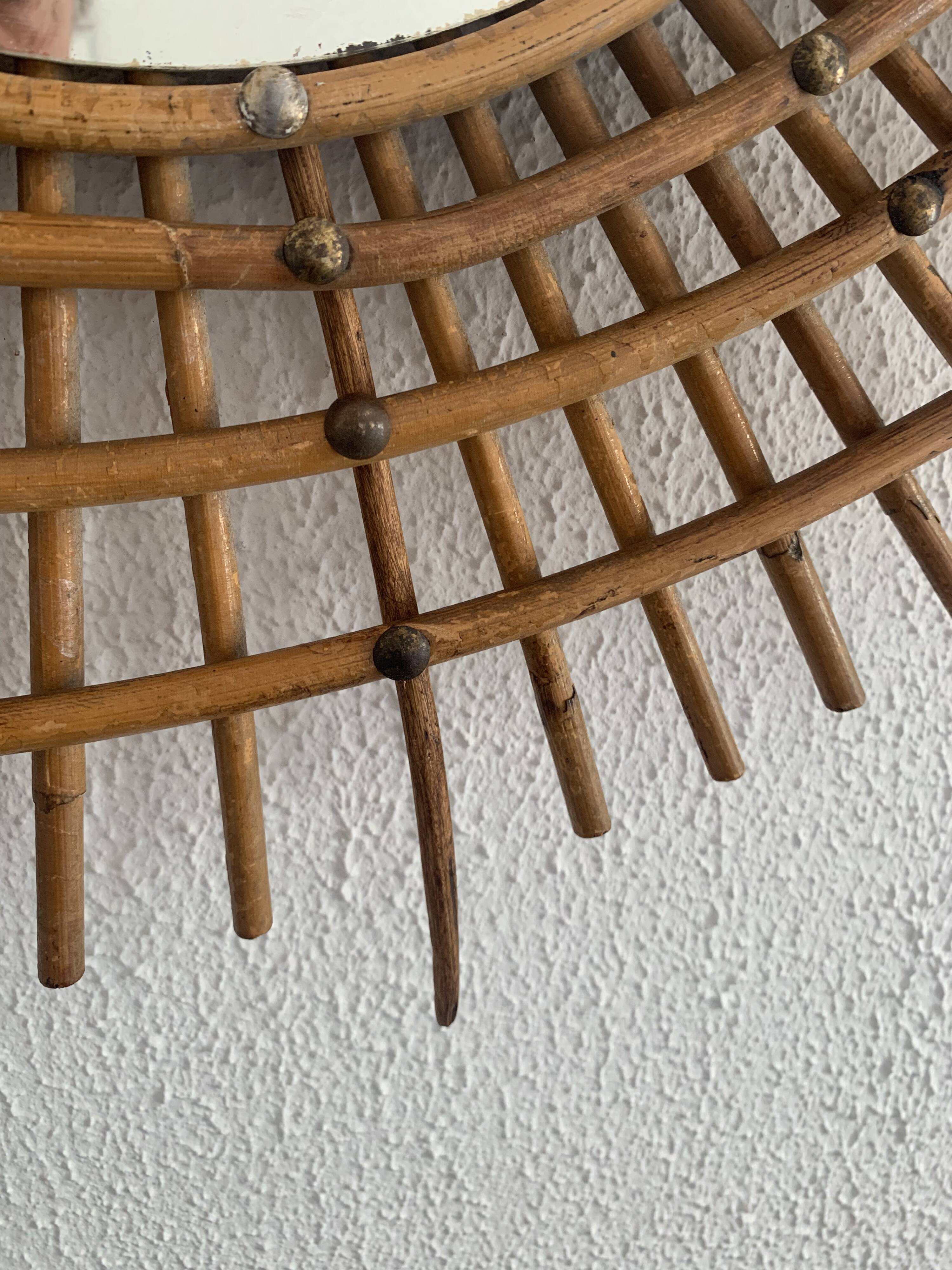 Vintage 1960s sunburst rattan ortf style spiral eye mirror - 90 x 67 cm