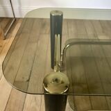 coffee table in smoked glass and black and gold metal from the 70s