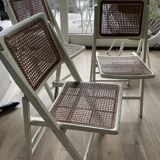 4 folding chairs with wicker seating