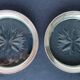 2 Bottle coasters in cut glass and silver metal