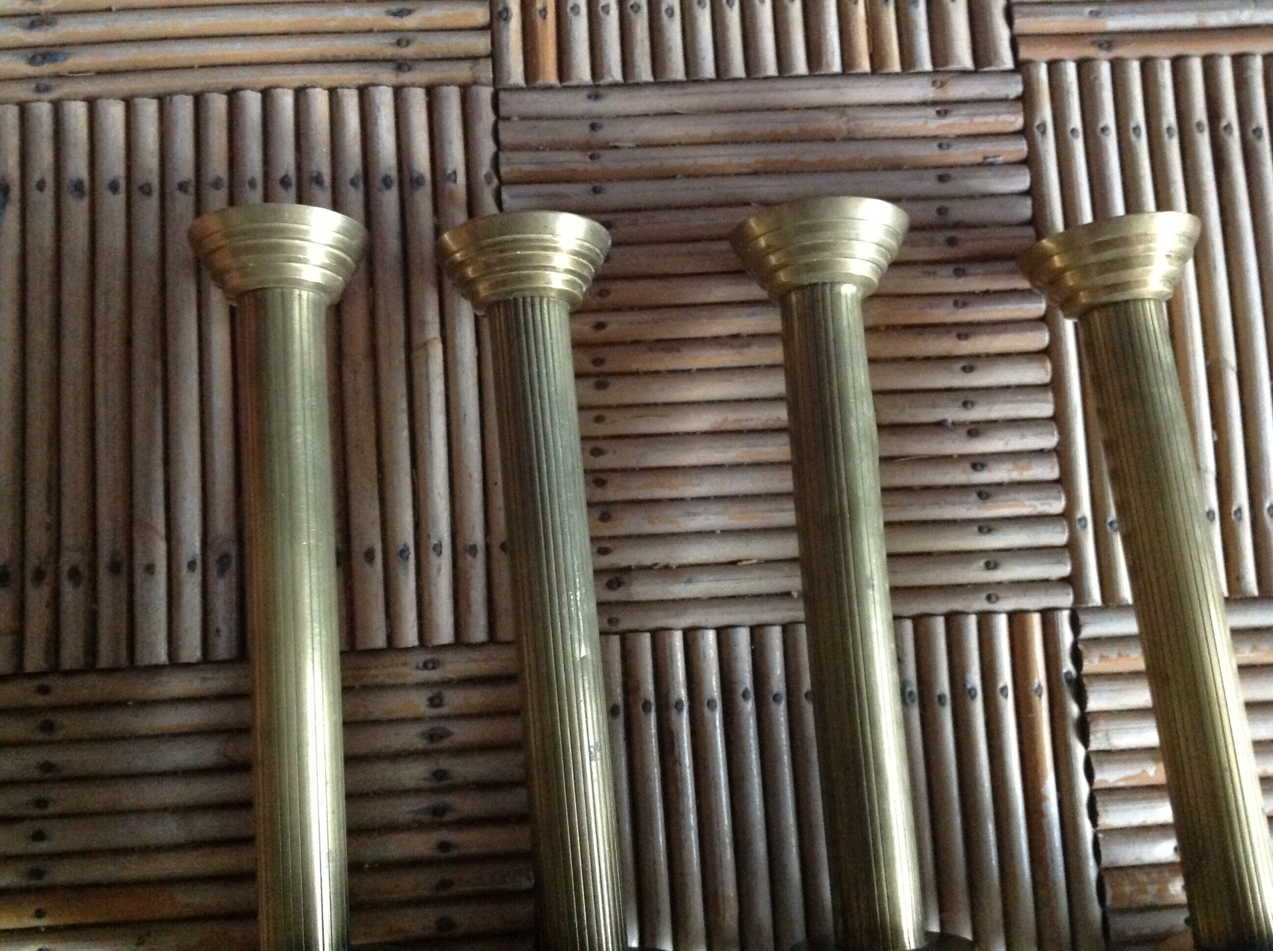 Series of 4 brass candlesticks