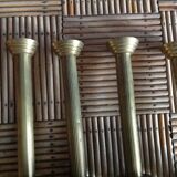 Series of 4 brass candlesticks