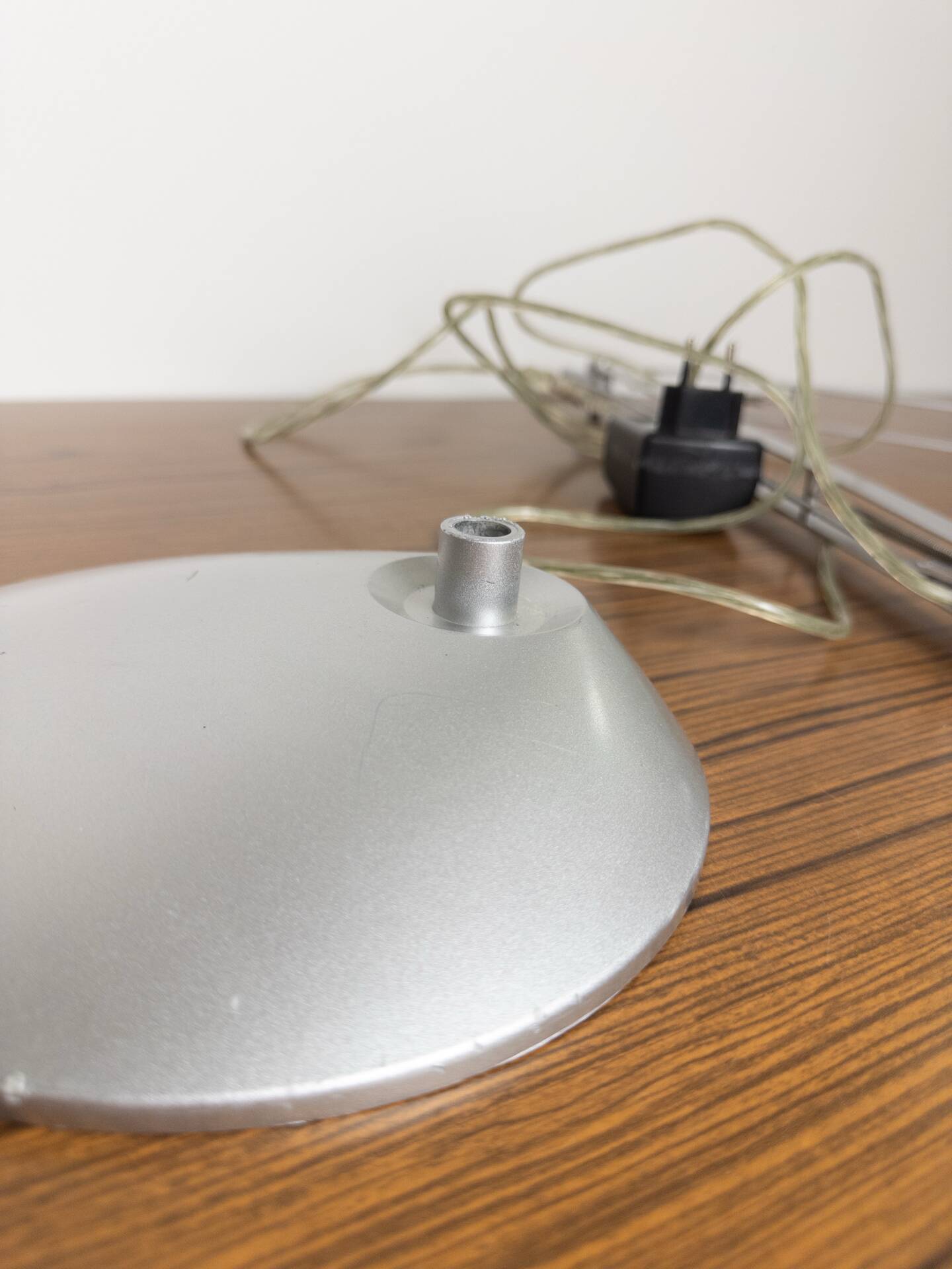 Grey LED architect lamp with spring arm and swivel base.