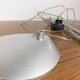Grey LED architect lamp with spring arm and swivel base.