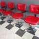 Quatre chaises de barbier en cuir rouge des années 1960 avec accoudoirs bakelite