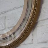 Round gilded wooden frame