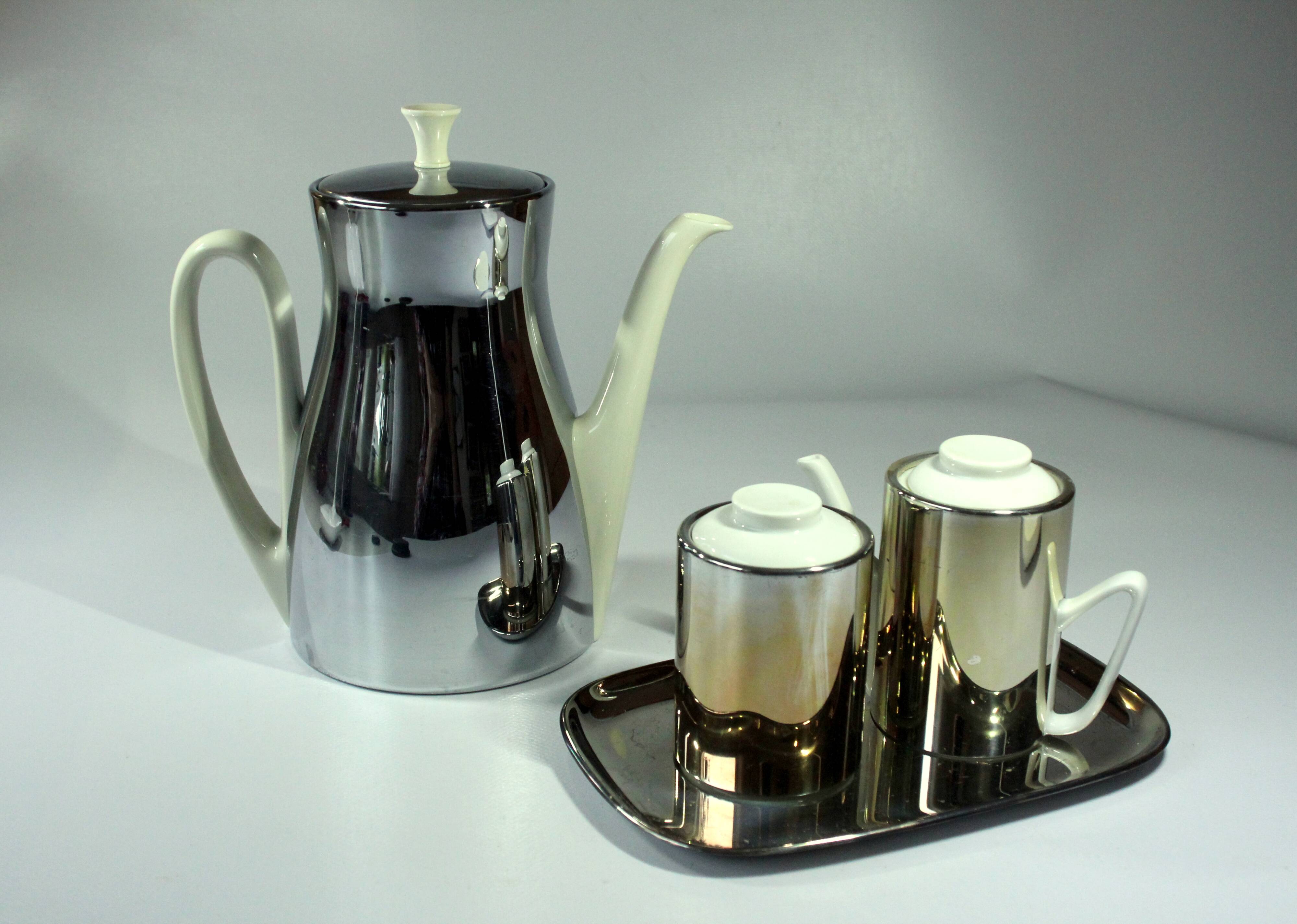 Coffee pot with metal isolated warming hood as a set with milk jug and sugar bowl, Vintage
