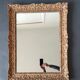 Large Montparnasse rocaille style frame in carved wood mounted in mirror.