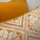 Square orange graphic cushion