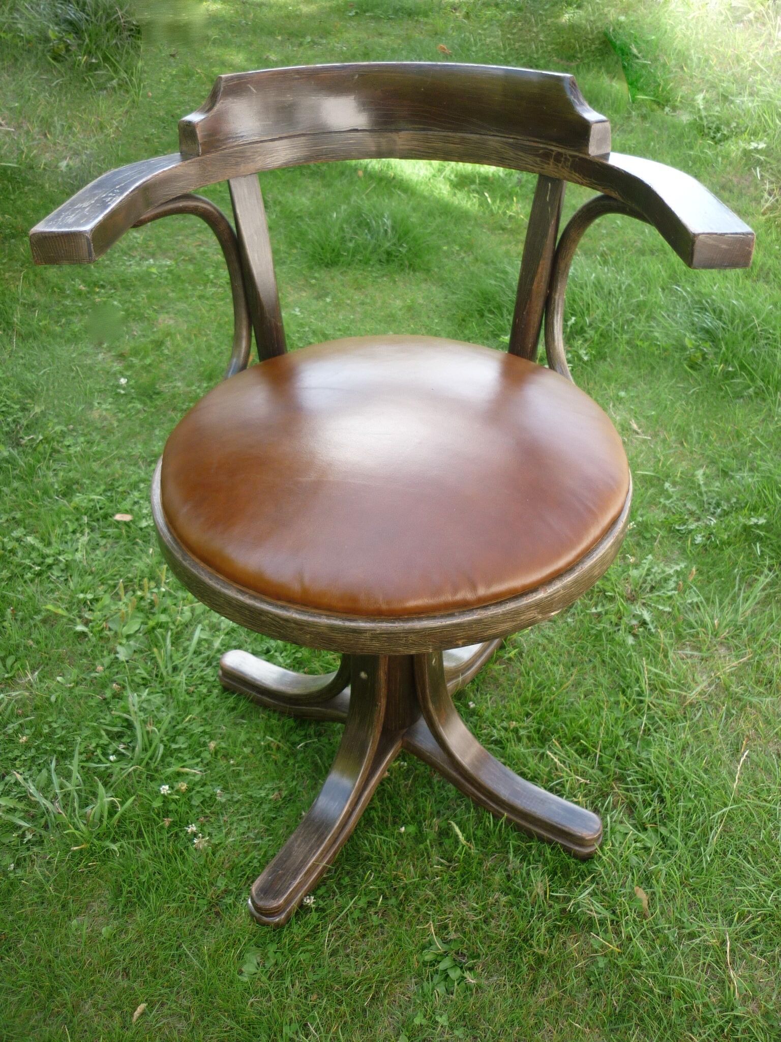 Swivel leather armchair