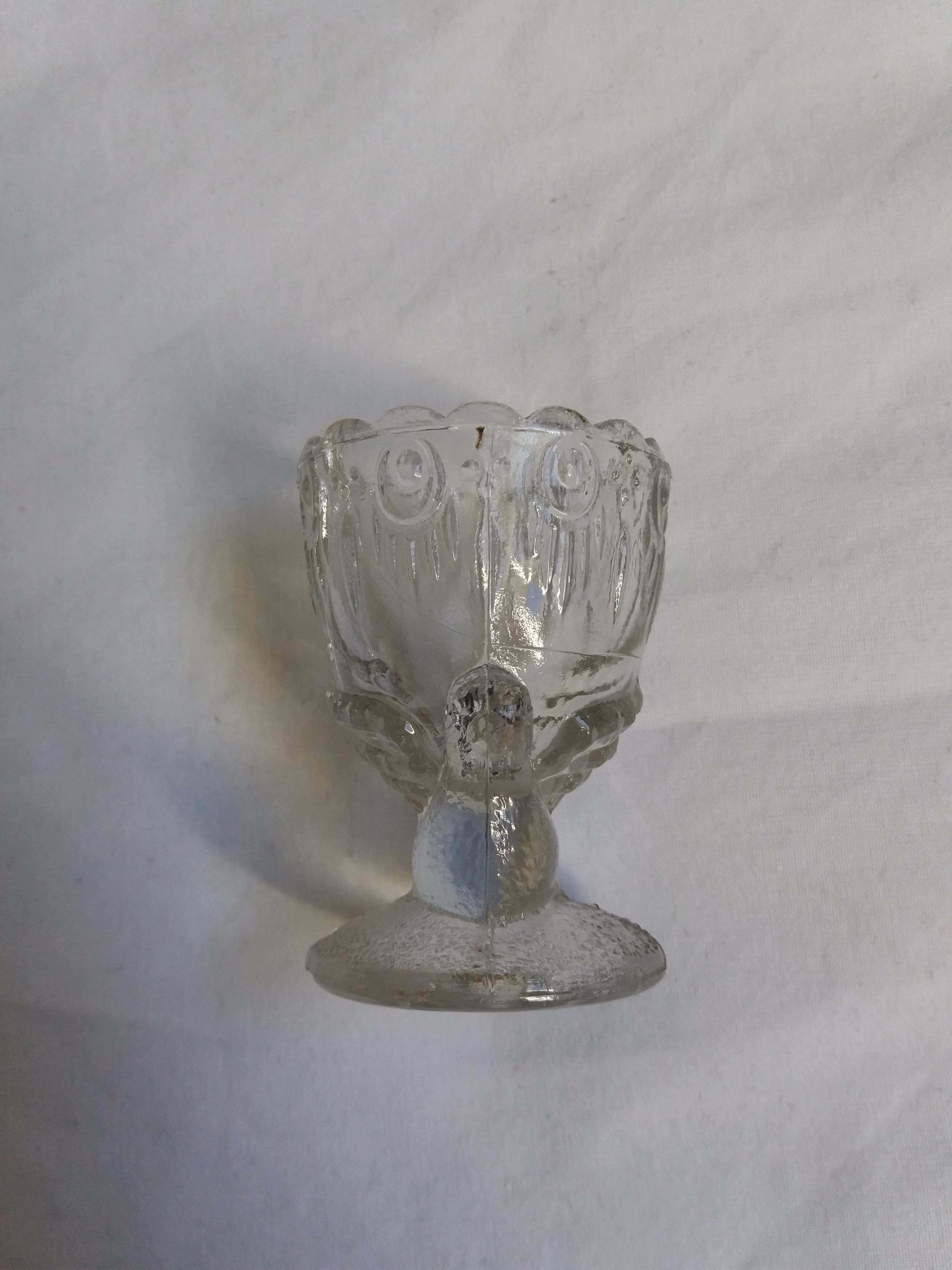 Molded glass egg cup with pigeon bird