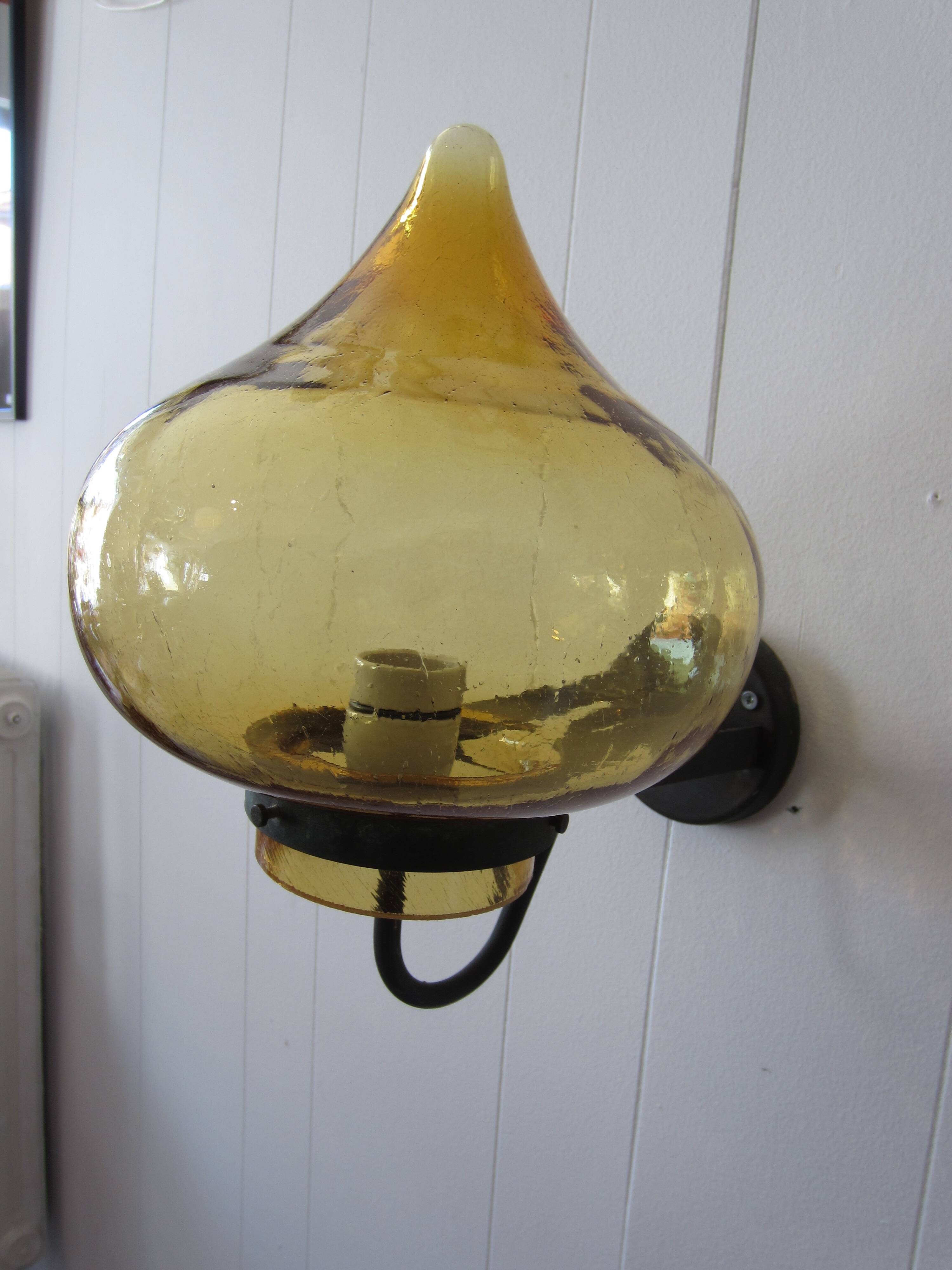 Scandinavian outdoor wall light in copper and amber glass