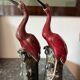 Pair of ceramic red glazed wading bird (crane) figurines.