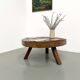 Brutalist coffee table in solid teak, monolithic slab, tripod base.