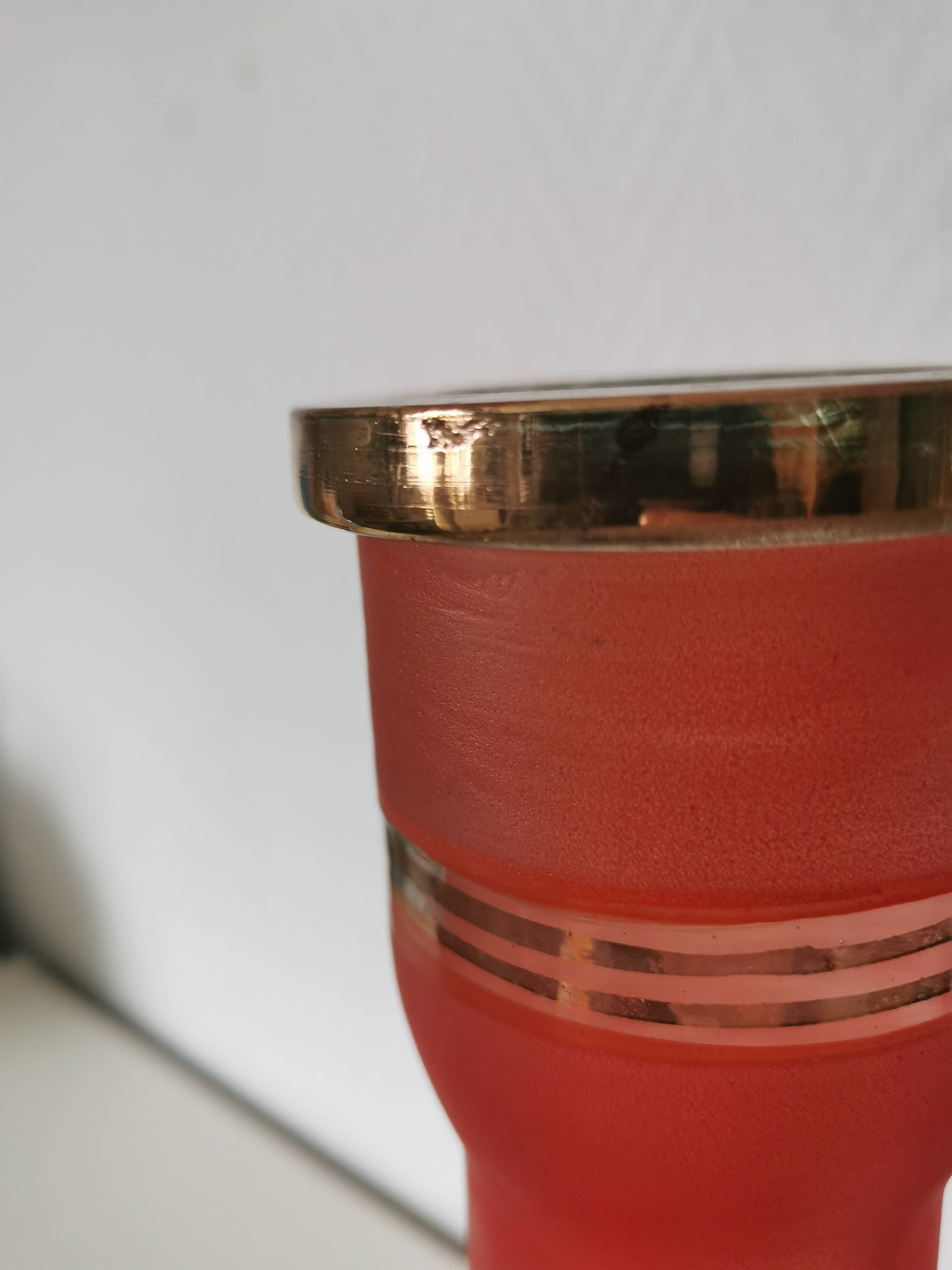 painted glass vase, red and gold granite appearance