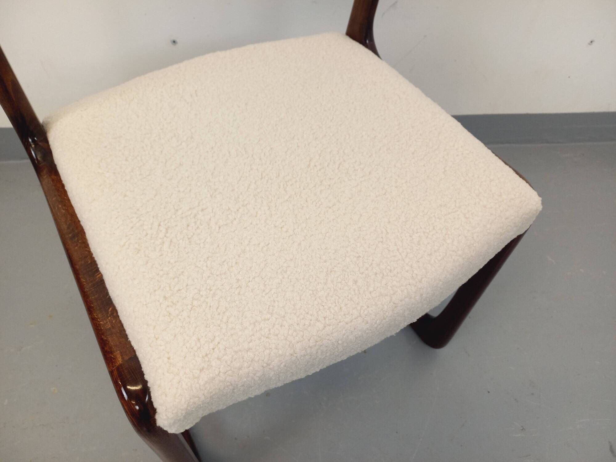Vintage sled chair by Baumann in wood and boucle fabric.