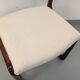 Vintage sled chair by Baumann in wood and boucle fabric.