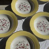 Set of 9 large vintage yellow deep plates with pink flowers and a gold rim.
