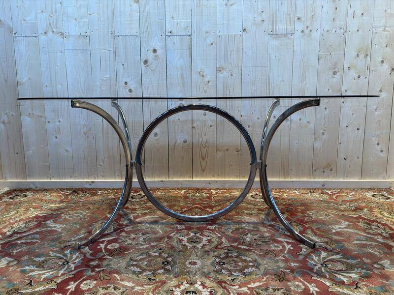 Contemporary glass and chrome dining table.