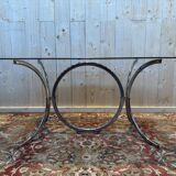 Contemporary glass and chrome dining table.