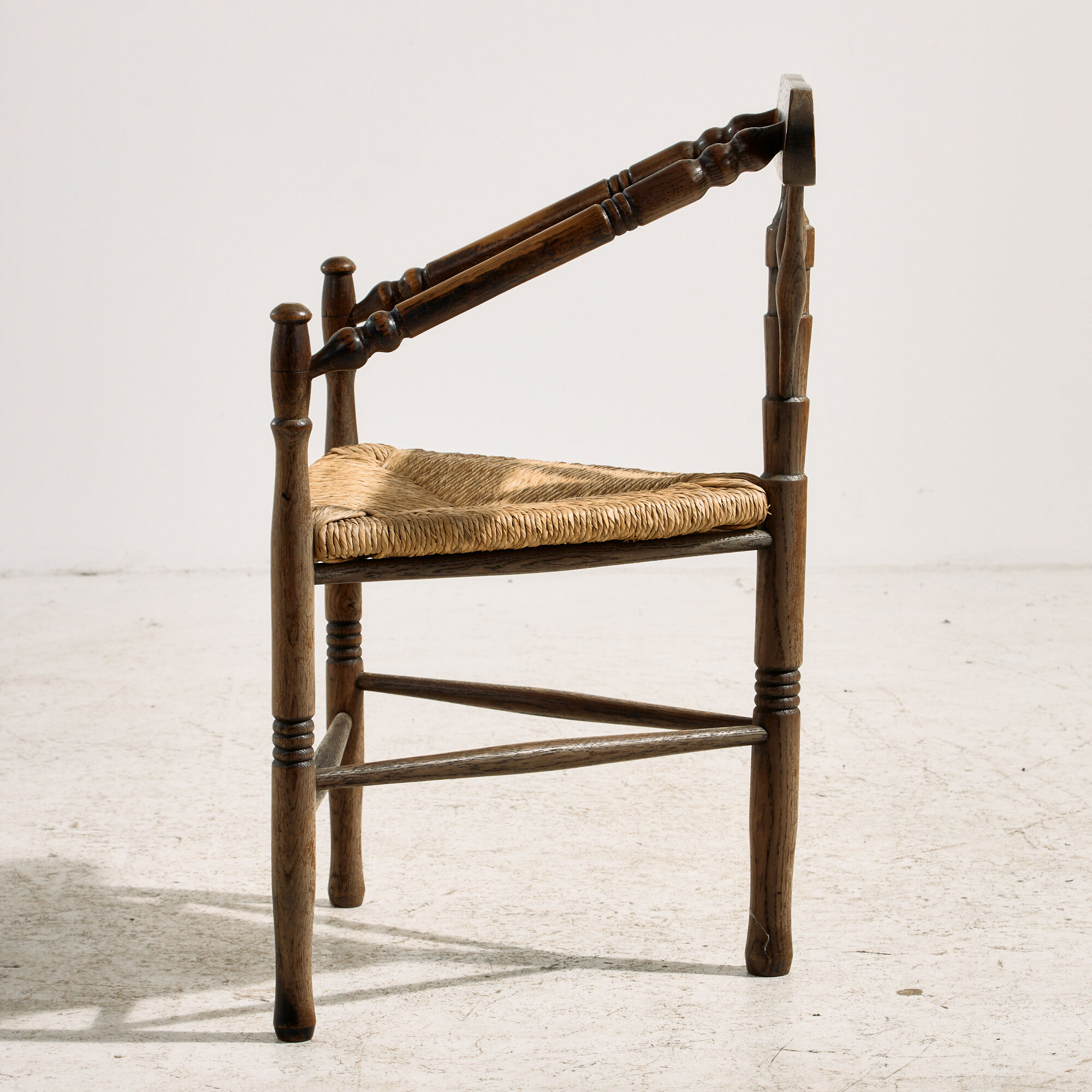 Oak armchair with three legs