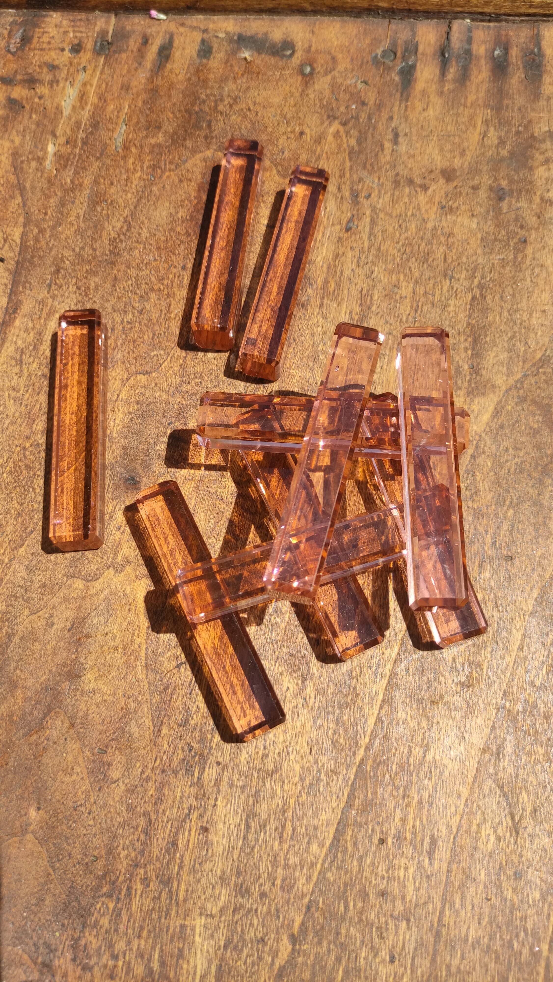 Ten pink glass knife holders