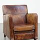 Dark brown design armchair made of sheepskin leather