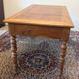 Cherry wood desk with a leather top.