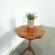 Round vintage wooden side table with inlaid veneer
