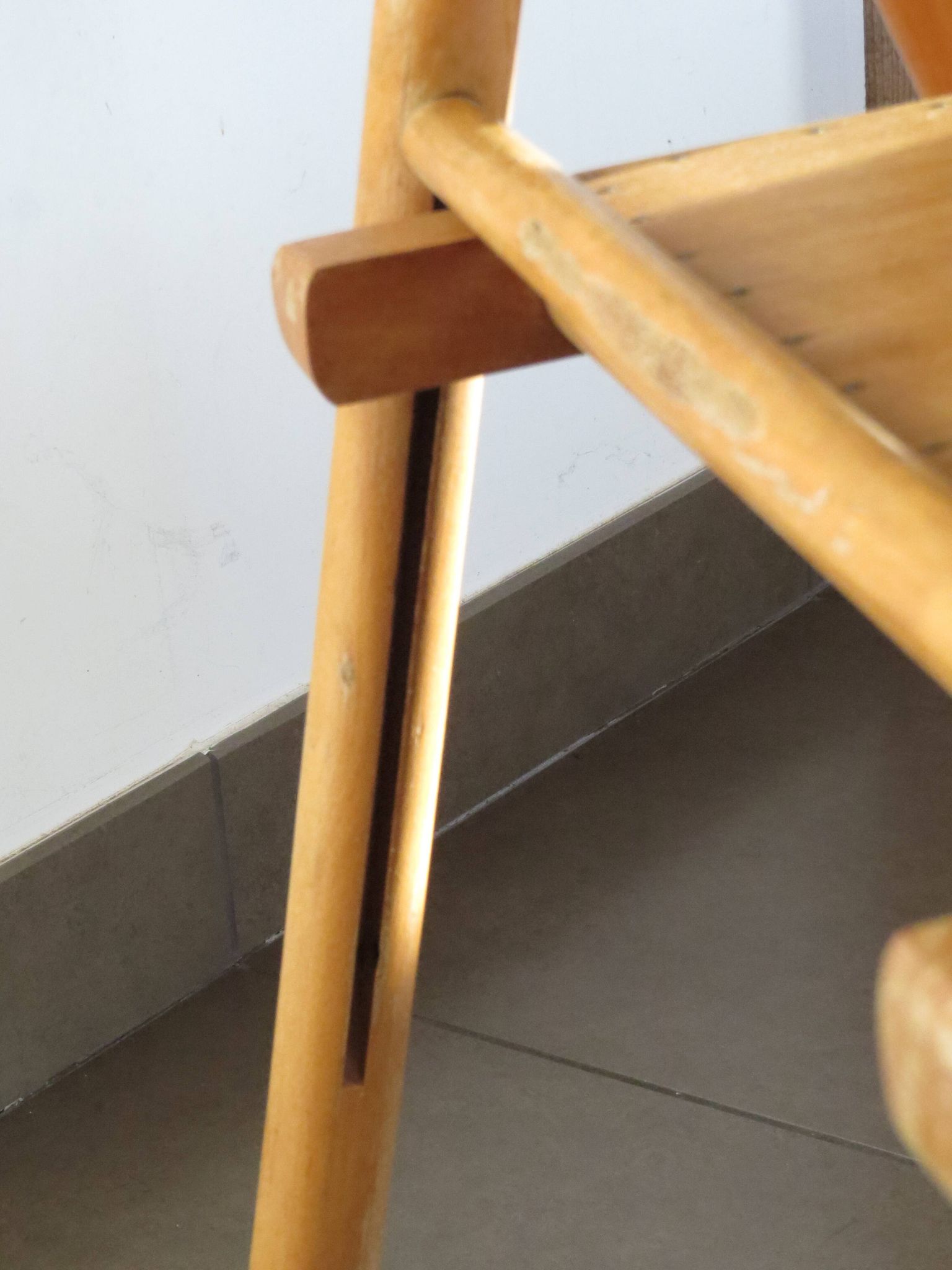 Pair of vintage wooden folding chairs with star pattern on seat
