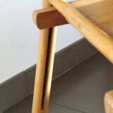 Pair of vintage wooden folding chairs with star pattern on seat