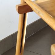 Pair of vintage wooden folding chairs with star pattern on seat