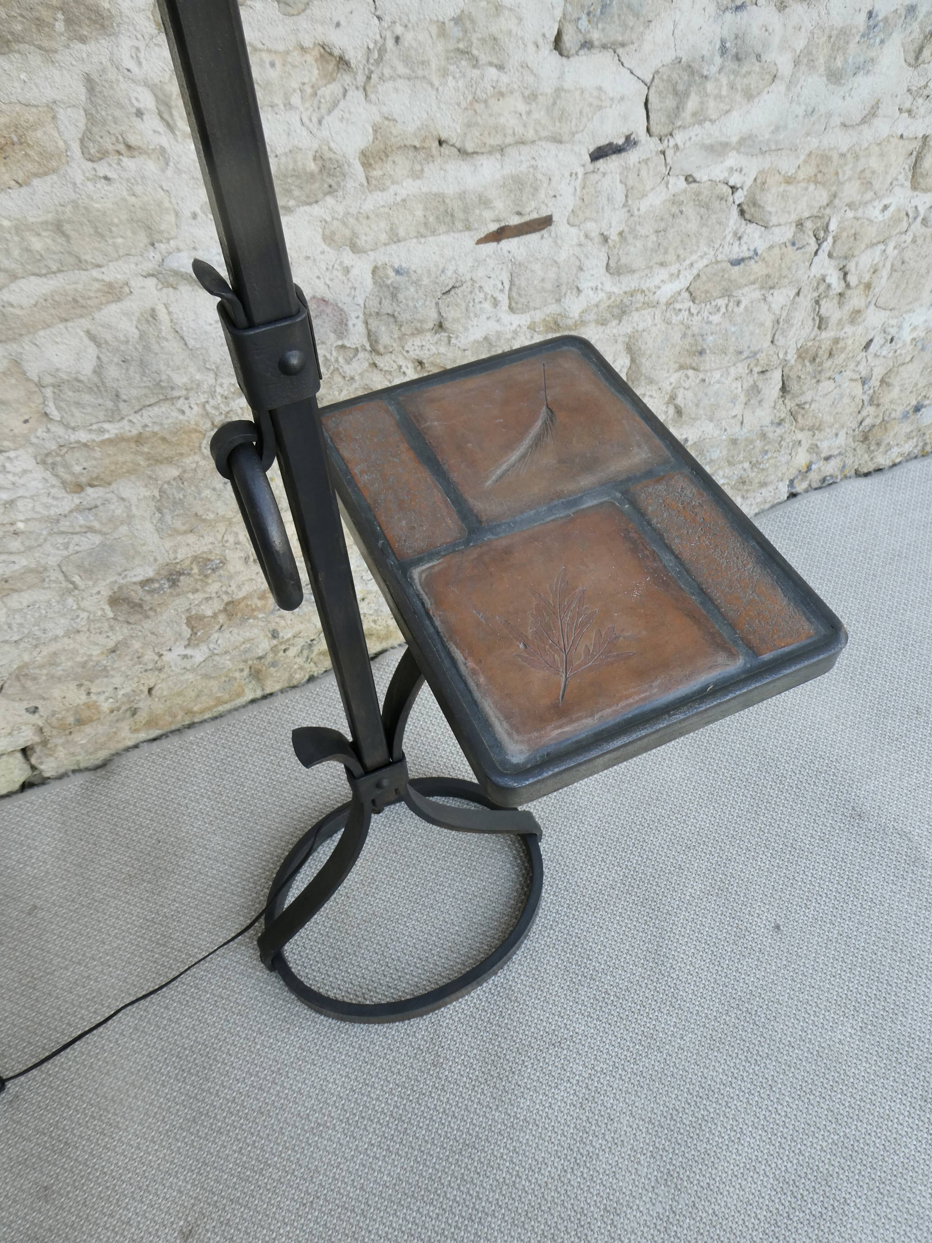 Wrought iron floor lamp with ceramic shelf herbarium decoration