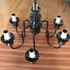 Metal chandelier and glass globes