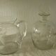 Glassware, including a jug and engraved crystal carafe.